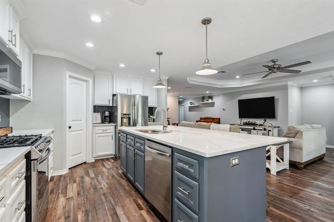 Extra storage in the island and plenty of counter space | Image 11
