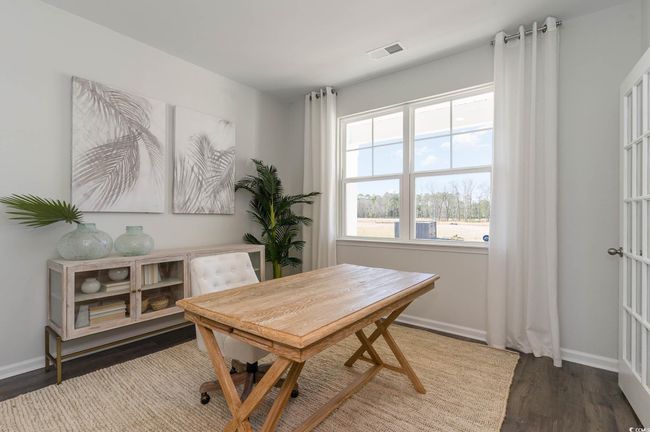 Home office featuring baseboards, wood finished floors, and visible vents | Image 10