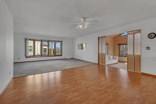 Large Main Floor Living Room and Beautiful Sunroom Addition with vaulted ceilings you are going to love! | Image 6