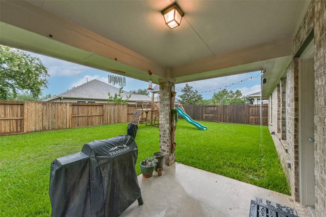 Covered back patio great for entertaining or a quiet cup of coffee. | Image 18