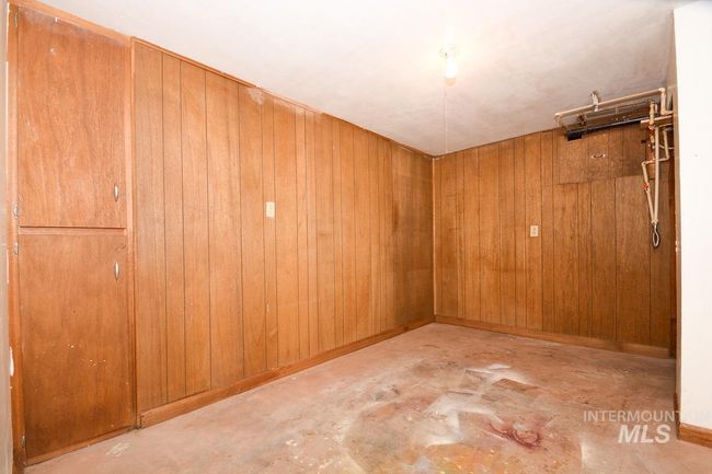 Unfurnished room with concrete floors and wooden walls | Image 35