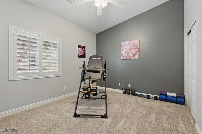 Workout area with a ceiling fan, baseboards, and carpet floors | Image 25