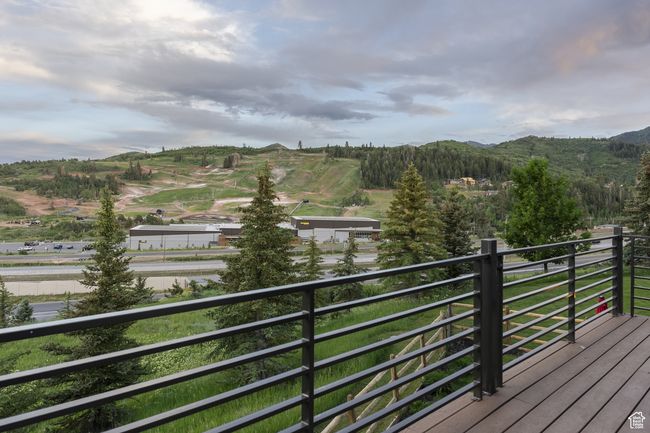 Wooden deck featuring a mountain view | Image 39