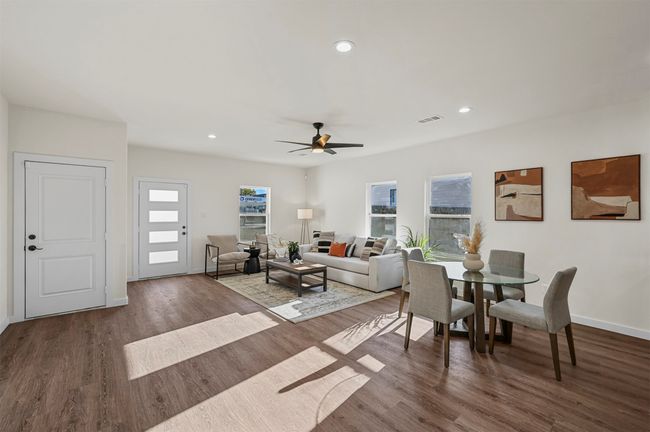 Living room with recessed lighting, a ceiling fan, visible vents, baseboards, and wood finished floors | Image 7