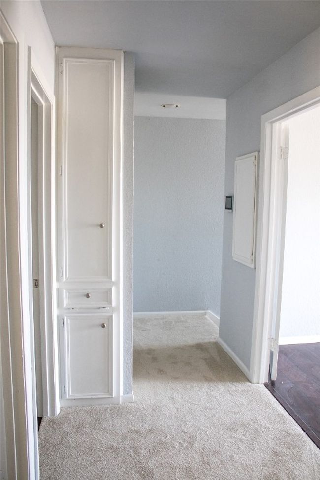 Hall featuring baseboards and carpet | Image 18