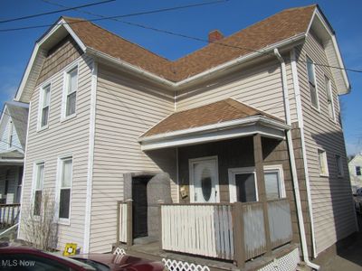 Back of house featuring a porch | Image 1