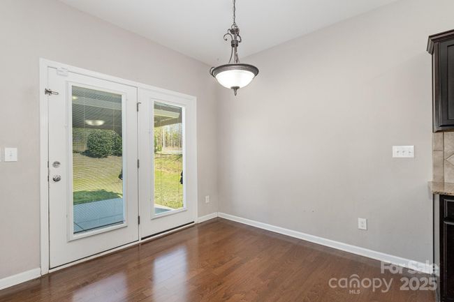Breakfast nook opens to the back yard patio. | Image 12