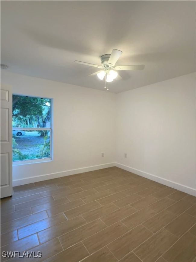 Spare room with ceiling fan | Image 9