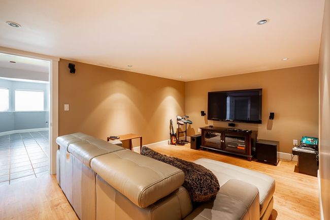 Living area with light wood finished floors and baseboards | Image 27