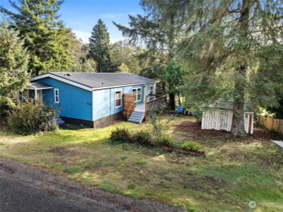 Super fun COASTAL remodel with privacy, deck and close proximity to the might Pacific awaits! | Image 1