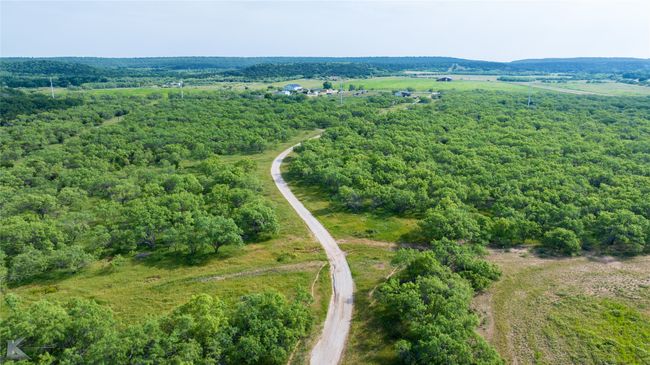 Bird's eye view of a heavily wooded area | Image 11