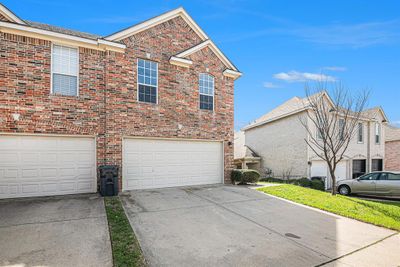 View of home's exterior featuring a garage | Image 2