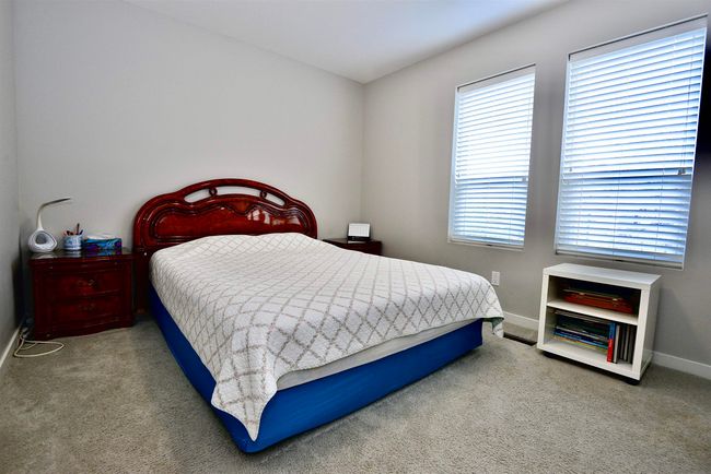 Carpeted bedroom with baseboards | Image 30