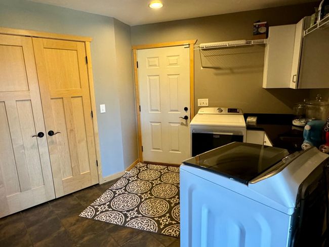 Main floor laundry, entry from garage | Image 27
