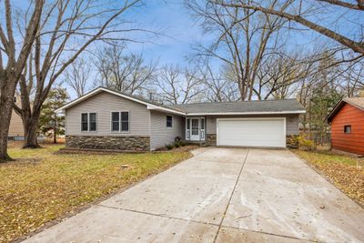 Great rambler/ranch home on a medium wooded lot, newer maintenance free siding, newer windows, 50 year steel roof, long concrete driveway, nice & large 2 level decks in back yard, beautiful home! | Image 2