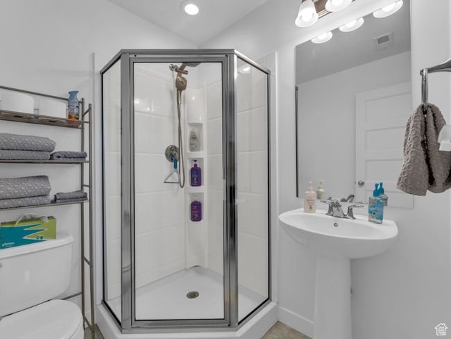 3/4 bath featuring toilet and a stall shower | Image 18