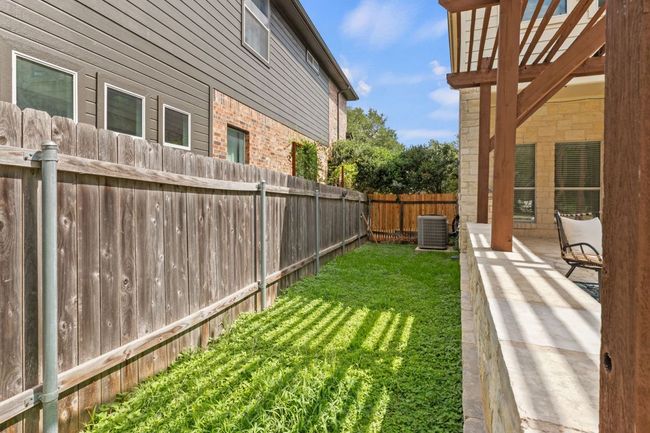 View of fenced backyard | Image 36