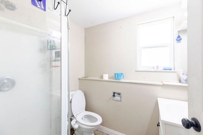 Bathroom featuring a shower stall and vanity | Image 19