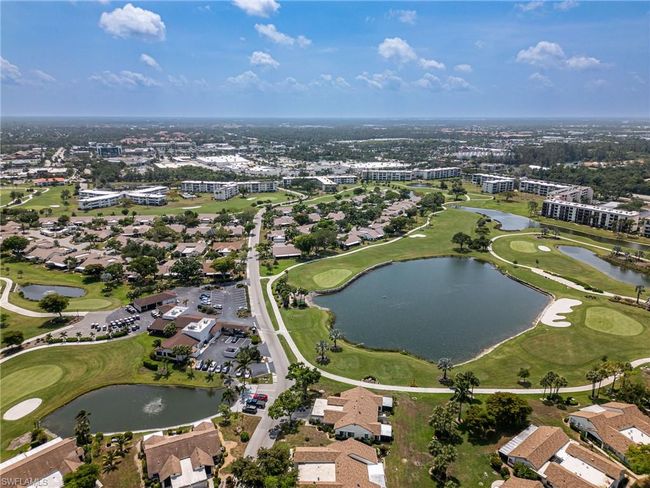 View of property location with a golf course and a nearby body of water | Image 34