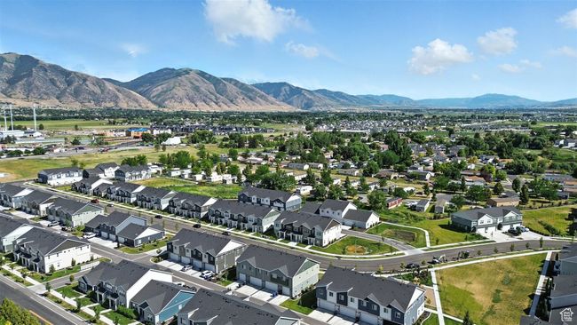 Aerial view of property's location featuring a mountainous background and nearby suburban area | Image 29