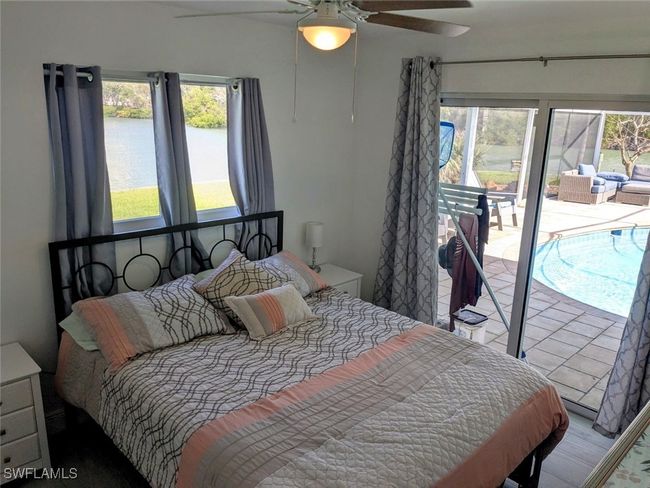 Bedroom with a ceiling fan and access to outside | Image 33