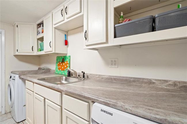 Laundry room with washer and dryer. | Image 17