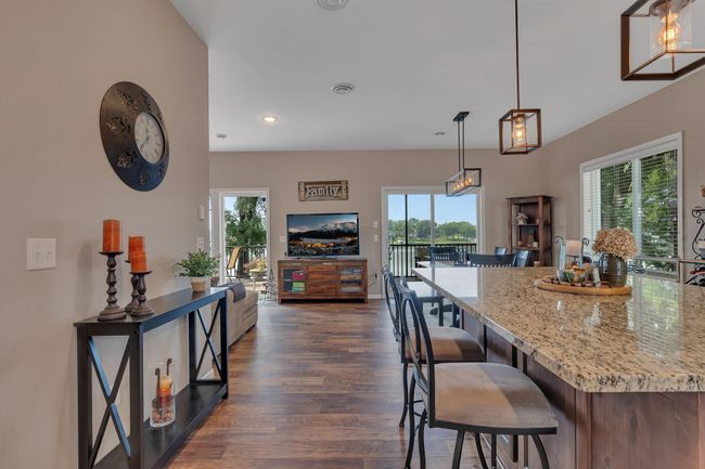 Take one step into the home and your can see straight to the water through the many windows on the main level | Image 8
