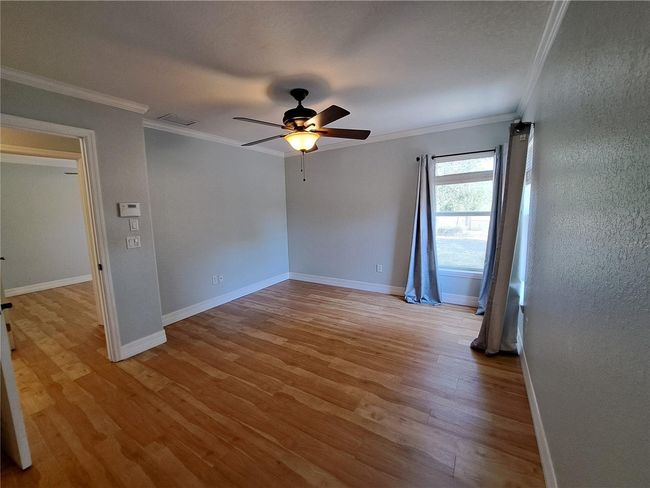 Primary bedroom across the hall from Bed #2 also has Backyard views, walk in closet and private bath. | Image 15