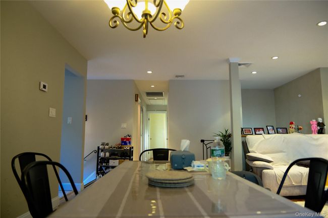 Dining room with recessed lighting and a chandelier | Image 14