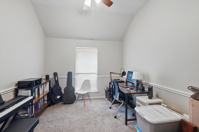 Office area with a ceiling fan, vaulted ceiling, and carpet | Image 10