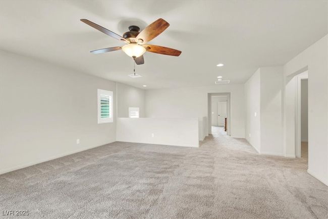 Spare room featuring light colored carpet, ceiling fan, and recessed lighting | Image 40