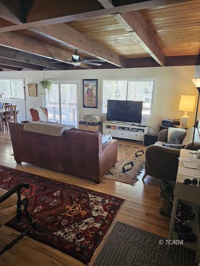living room w/ wood beams | Image 16