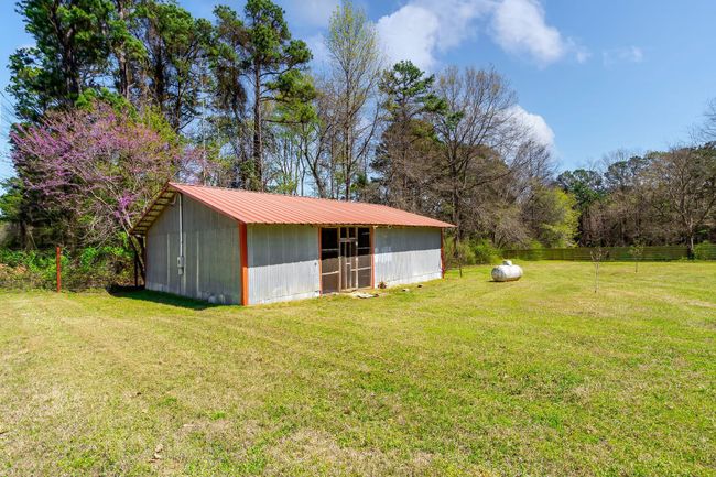 View of pole building featuring a lawn | Image 6