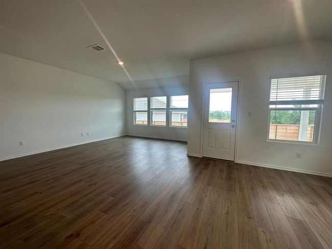 Unfurnished living room with dark wood-type flooring and baseboards | Image 20