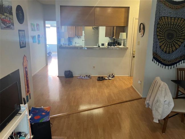 Living room with wood finished floors and baseboards | Image 15