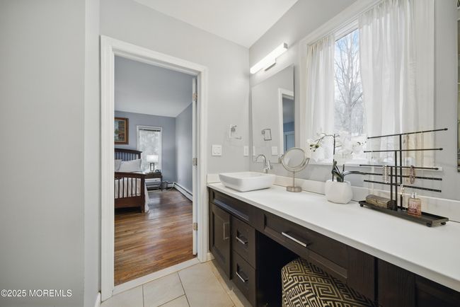 Primary Bedroom with Newer Bathroom with 2 sinks & great design, large windows & builtins in large closets. | Image 23