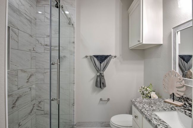 Bathroom featuring vanity and a stall shower | Image 15
