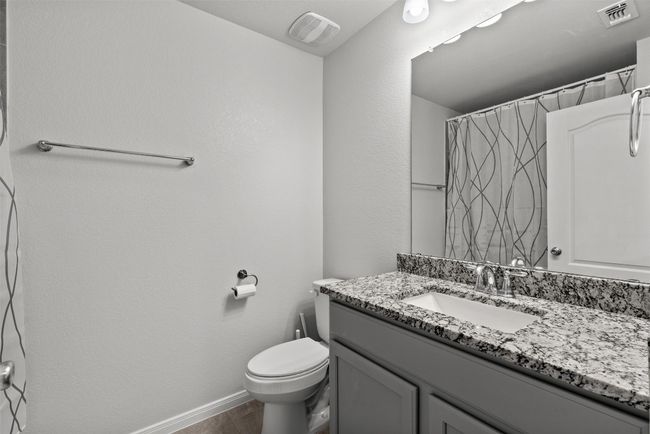 Full bathroom with vanity and curtained shower | Image 21