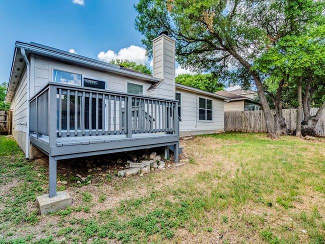 Back of property featuring a wooden deck and a chimney | Image 27