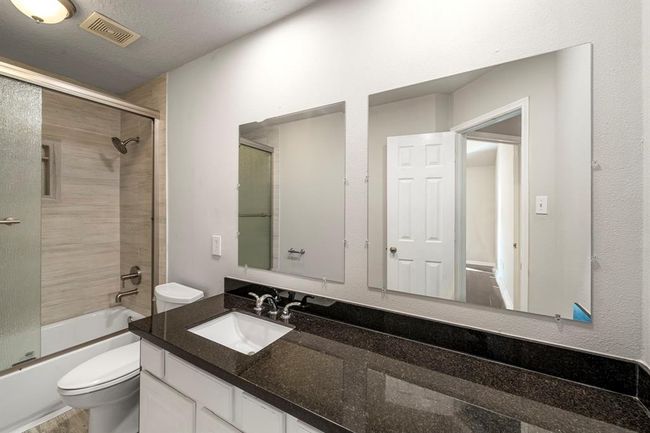 Shared guest bath with expansive countertop space. | Image 33