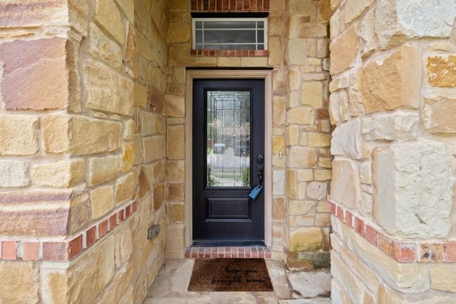 View of exterior entry with stone siding | Image 4