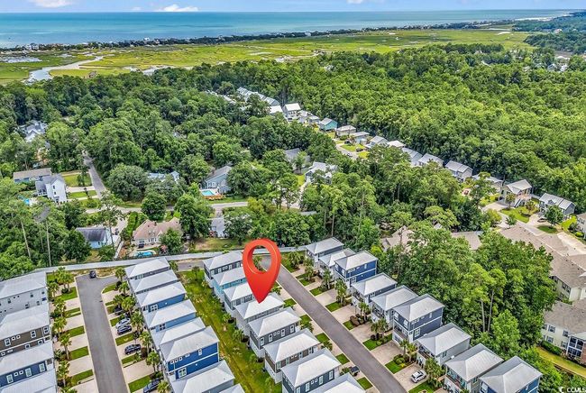 Aerial view of property's location with a nearby body of water and nearby suburban area | Image 37