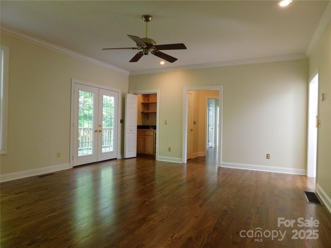 Frnch doors in living room lead to open deck and back yard. | Image 20