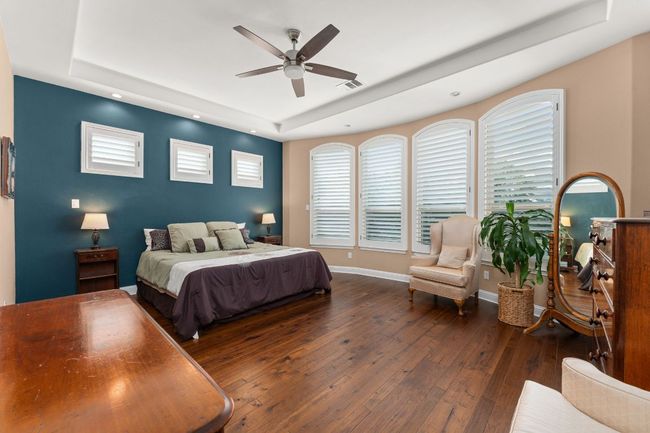 Primary bedroom with high ceilings and lots of natural light. | Image 11