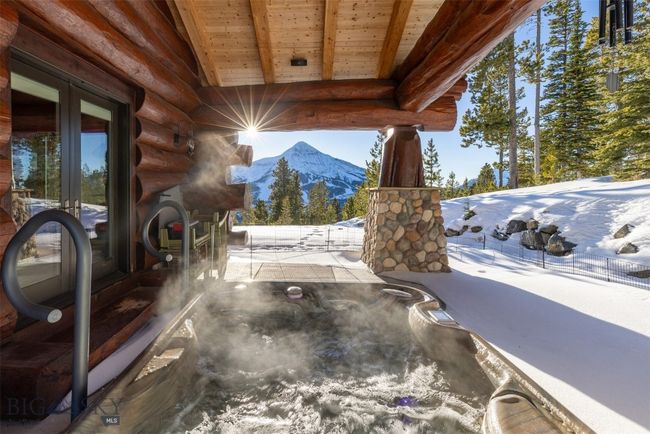 North side patio off of Primary Suite, with hot tub and Lone Mountain views. | Image 69