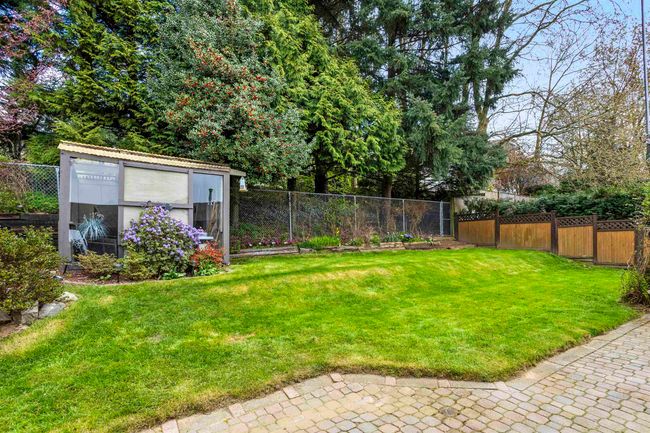 View of yard featuring a fenced backyard and an outbuilding | Image 30