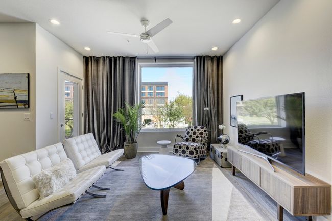 Living area featuring ceiling fan and recessed lighting | Image 5