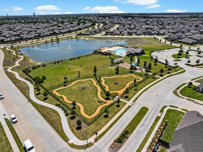Aerial perspective of suburban area with a nearby body of water | Image 17
