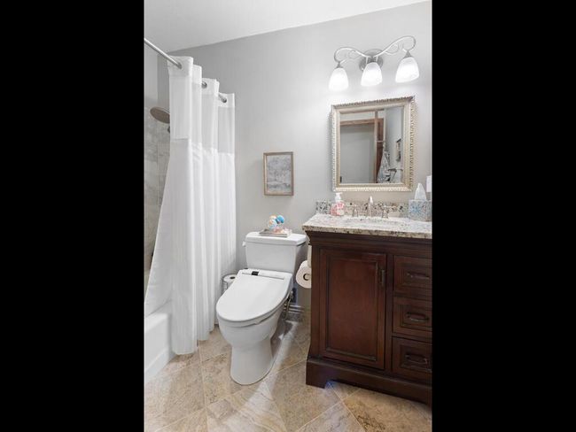Full Family Bath with granite vanity and heated tile floors | Image 37