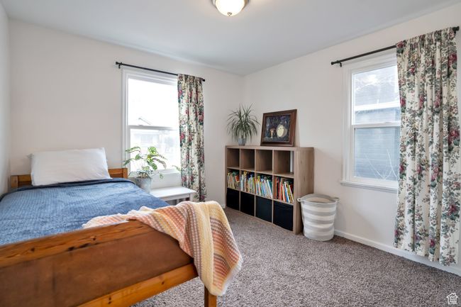 Carpeted bedroom featuring baseboards | Image 9
